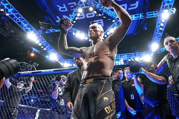 PHOENIX, ARIZONA - MAY 07: Charles Oliveira of Brazil reacts after his submission victory over Justin Gaethje in the UFC lightweight championship fight during the UFC 274 event at Footprint Center on May 07, 2022 in Phoenix, Arizona. (Photo by Jeff Bottari/Zuffa LLC)