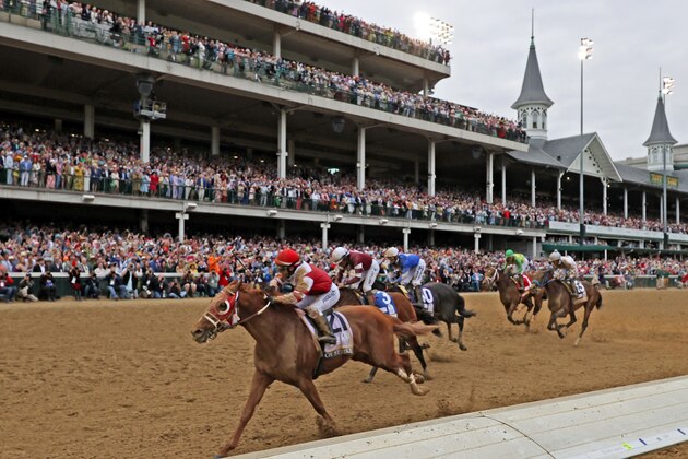 LOUISVILLE, KY - MAY 07: Jockey Sonny Leon aboard Rich Strike (21) wins the148th running of the Kentucky Derby on May 7th, 2022, at Churchill Downs in Louisville, Kentucky. (Photo by Brian Spurlock/Icon Sportswire via Getty Images)