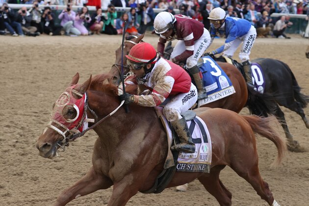 LOUISVILLE, KY - MAY 07: Jockey Sonny Leon aboard Rich Strike (21) wins the148th running of the Kentucky Derby at Churchill Downs in Louisville, Kentucky. (Photo by Brian Spurlock/Icon Sportswire via Getty Images)