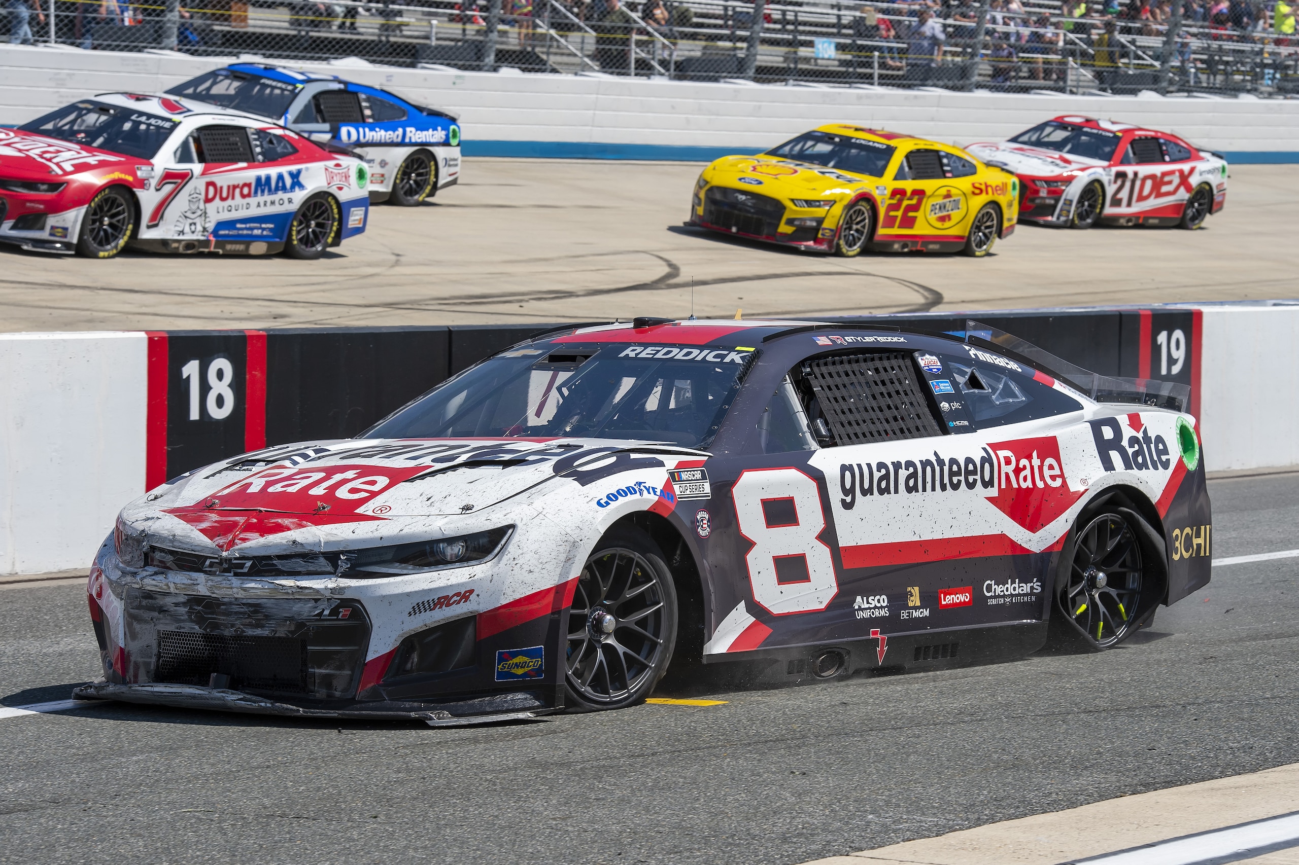 Tyler Reddick (8) drives down pit road with multiple flat tires during a NASCAR Cup Series auto race at Dover Motor Speedway, Monday, May 2, 2022, in Dover, Del. (AP Photo/Jason Minto)