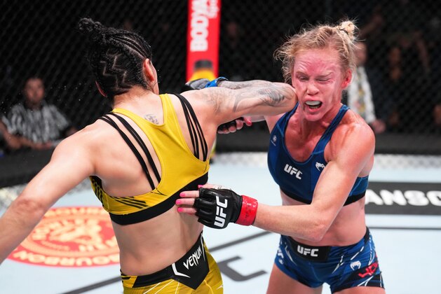 LAS VEGAS, NEVADA - MAY 21: (L-R) Ketlen Vieira of Brazil lands a spinning back-elbow against Holly Holm in a bantamweight bout during the UFC Fight Night event at UFC APEX on May 21, 2022 in Las Vegas, Nevada. (Photo by Chris Unger/Zuffa LLC)