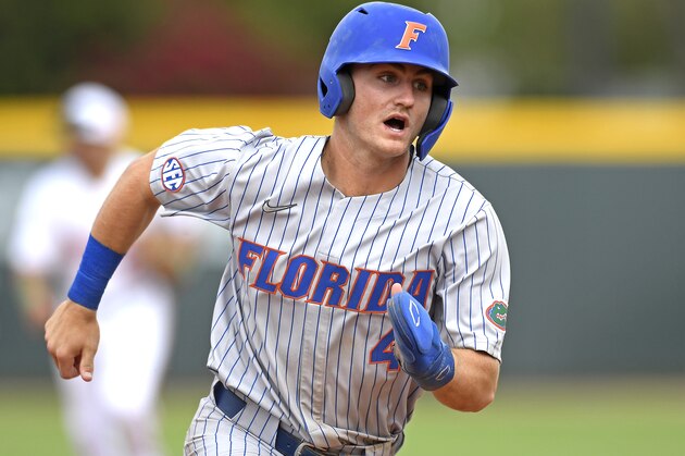 CORAL GABLES, FL - MARCH 06: Florida outfielder Jud Fabian (4) runs to third base in the sixth inning as the University of Miami Hurricanes faced the University of Florida Gators on March 6, 2022, at Mark Light Field at Alex Rodriguez Park in Coral Gables, Florida. (Photo by Samuel Lewis/Icon Sportswire via Getty Images)