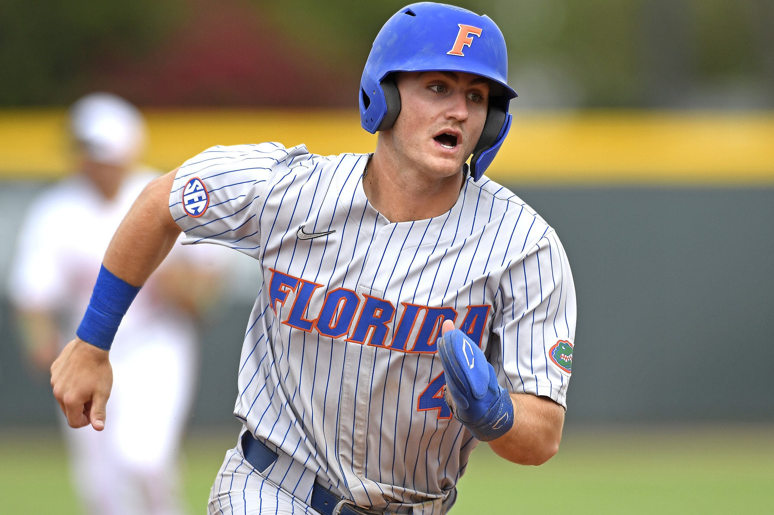 CORAL GABLES, FL - MARCH 06: Florida outfielder Jud Fabian (4) runs to third base in the sixth inning as the University of Miami Hurricanes faced the University of Florida Gators on March 6, 2022, at Mark Light Field at Alex Rodriguez Park in Coral Gables, Florida. (Photo by Samuel Lewis/Icon Sportswire via Getty Images) CORAL GABLES, FL - MARCH 06: Florida outfielder Jud Fabian (4) runs to third base in the sixth inning as the University of Miami Hurricanes faced the University of Florida Gators on March 6, 2022, at Mark Light Field at Alex Rodriguez Park in Coral Gables, Florida. (Photo by Samuel Lewis/Icon Sportswire via Getty Images)