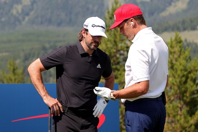 BIG SKY, MONTANA - JULY 06: Aaron Rodgers (L) and Tom Brady meet on the first tee during Capital One's The Match at The Reserve at Moonlight Basin on July 06, 2021 in Big Sky, Montana. (Photo by Stacy Revere/Getty Images for The Match)