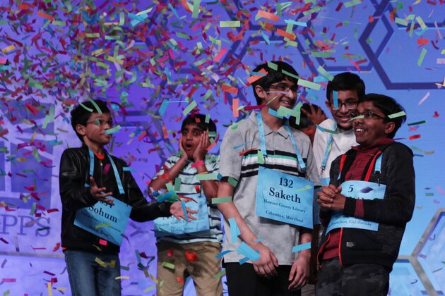 NATIONAL HARBOR, MARYLAND - MAY 31:  Co-champions Sohum Sukhatankar (L) of Dallas, Texas, Abhijay Kodali (2nd L) of Flower Mound, Texas, Saketh Sundar (3rd L) of Clarksville, Maryland, and Rishik Gandhasri (R) of San Jose, California, celebrate as confetti drops after 20 rounds of competition and won the championship of the Scripps National Spelling Bee at the Gaylord National Resort & Convention Center May 31, 2019 in National Harbor, Maryland. The winning spellers made history with eight co-champions, the most number in the spelling event history.(Photo by Alex Wong/Getty Images)
