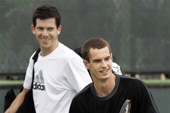 Unseeded Tim Henman, left, of Great Britain passes behind his countryman, 13th-seed Andy Murray on a practice court at the Pacific Life Open tennis tournament in Indian Wells, Calif. Wednesday, March 7, 2007. (AP Photo/Elise Amendola)