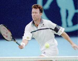 England's Jeremy Bates makes a forehand return against American Todd Martin in the second round match of the Seiko Super Tennis tournament in Tokyo Wednesday, Oct. 11, 1995. Bates got the first set but was defeated by Martin 6-3, 4-6, 4-6. (AP Photo/Katsu