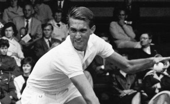 ** FILE ** In this June 1965 file photo, Donald Dell hits a return to Roger Taylor at the Wimbledon tennis tournament in Wimbledon, England. Dell was elected to the International Tennis Hall of Fame on Thursday, Jan. 15, 2009. Dell co-founded the Associat