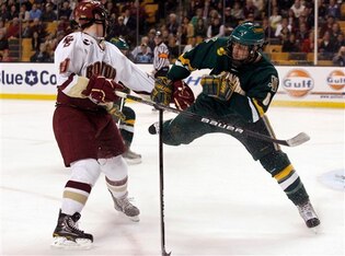 Vermont's Kyle Medvec (6) tries to defend against Boston College's Chris Kreider (19) during the second period of the Hockey East NCAA college hockey tournament  Friday, March 19, 2010, in Boston. (AP Photo/Mary Schwalm)
