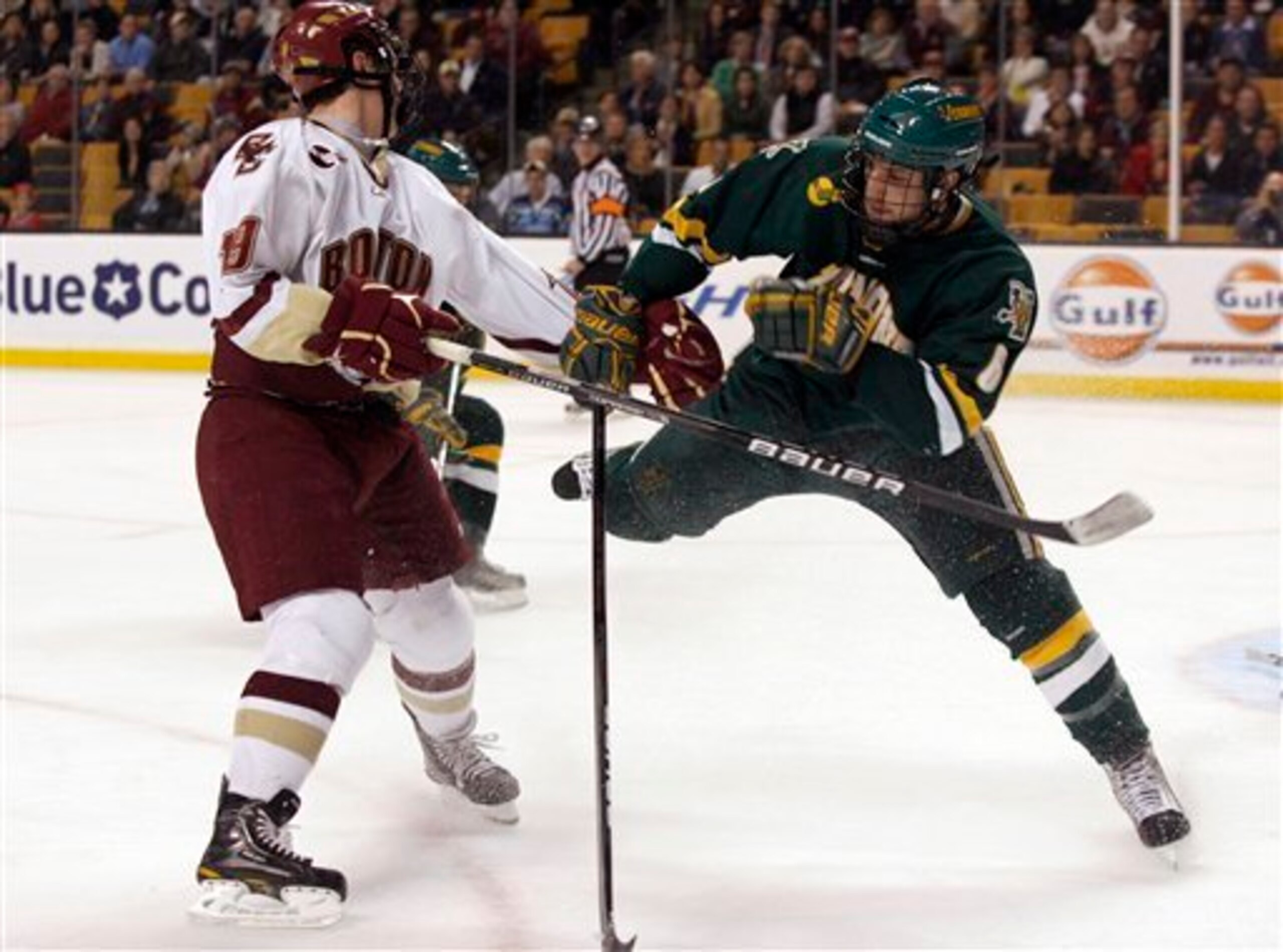 Vermont's Kyle Medvec (6) tries to defend against Boston College's Chris Kreider (19) during the second period of the Hockey East NCAA college hockey tournament  Friday, March 19, 2010, in Boston. (AP Photo/Mary Schwalm)