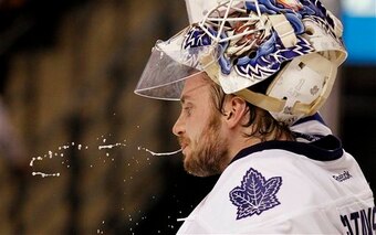 Toronto Maple Leafs goalie Jonas Gustavsson spits out water after giving up a goal to the Boston Bruins during the second period of an NHL hockey game in Boston, Monday, March 19, 2012. (AP Photo/Winslow Townson)