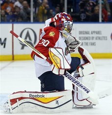 Florida Panthers goalie Scott Clemmensen makes a save in the second period of an NHL hockey game against the New York Islanders at Nassau Coliseum in Uniondale, N.Y., Tuesday, April 1, 2014. The Islanders won 4-2. (AP Photo/Paul J. Bereswill)