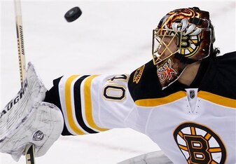 Boston Bruins goalie Tuukka Rask turns away a shot in the first period of an NHL hockey game against the Pittsburgh Penguins in Pittsburgh on Monday, Jan. 10, 2011. (AP Photo/Gene J. Puskar)