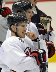 New Jersey Devils' Zach Parise and Travis Zajac, rear, look on during practice as the Devils prepare for the NHL hockey season Saturday, Sept. 18, 2010 in Newark, N.J. (AP Photo/Bill Kostroun)
