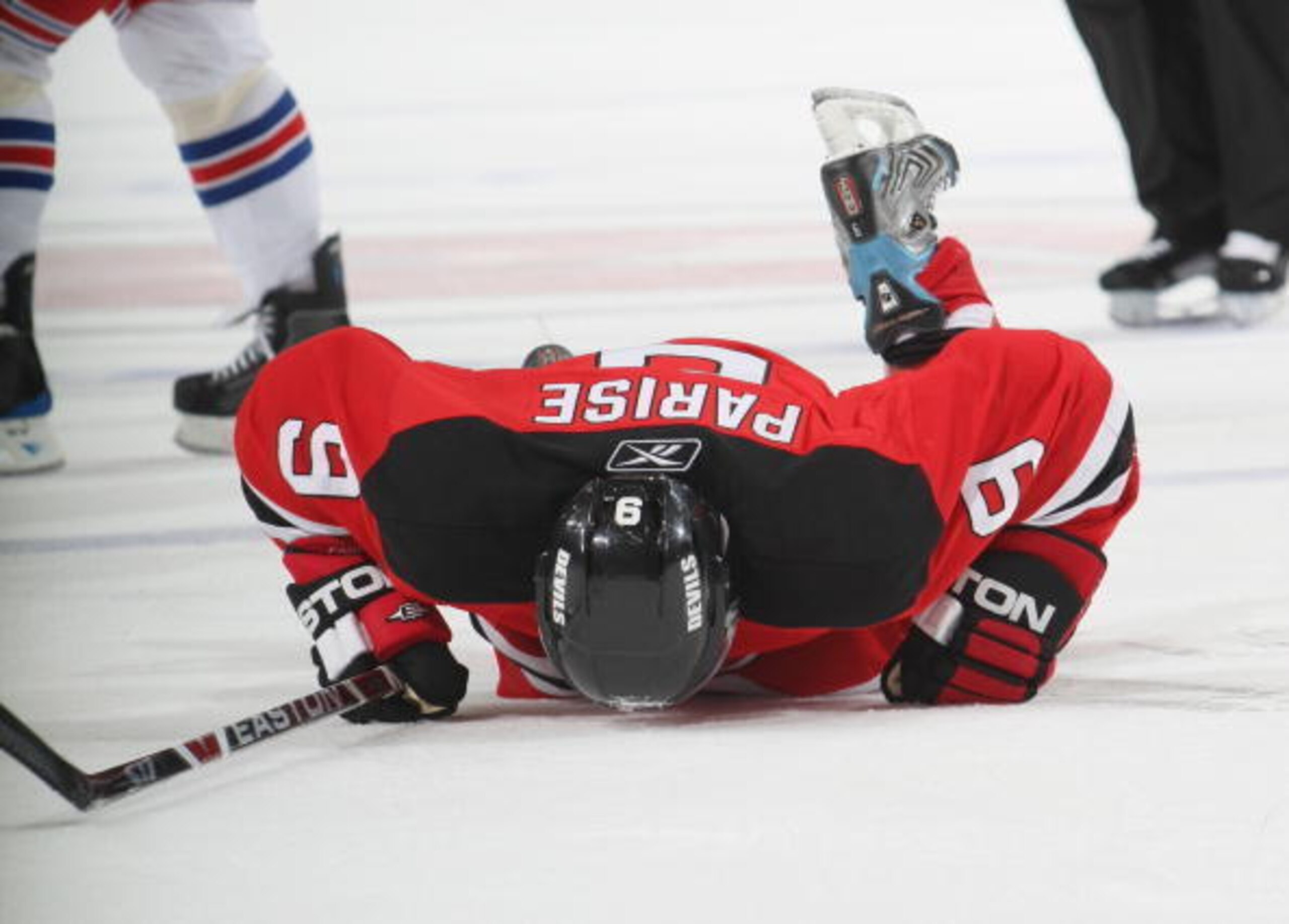NEWARK, NJ - NOVEMBER 12:  Zach Parise #9 of the New Jersey Devils lays injured on the ice against the New York Rangers during the NHL game on November 12, 2008 at the Prudential Center in Newark, New Jersey.  The Rangers defeated the Devils 5-2. (Photo b
