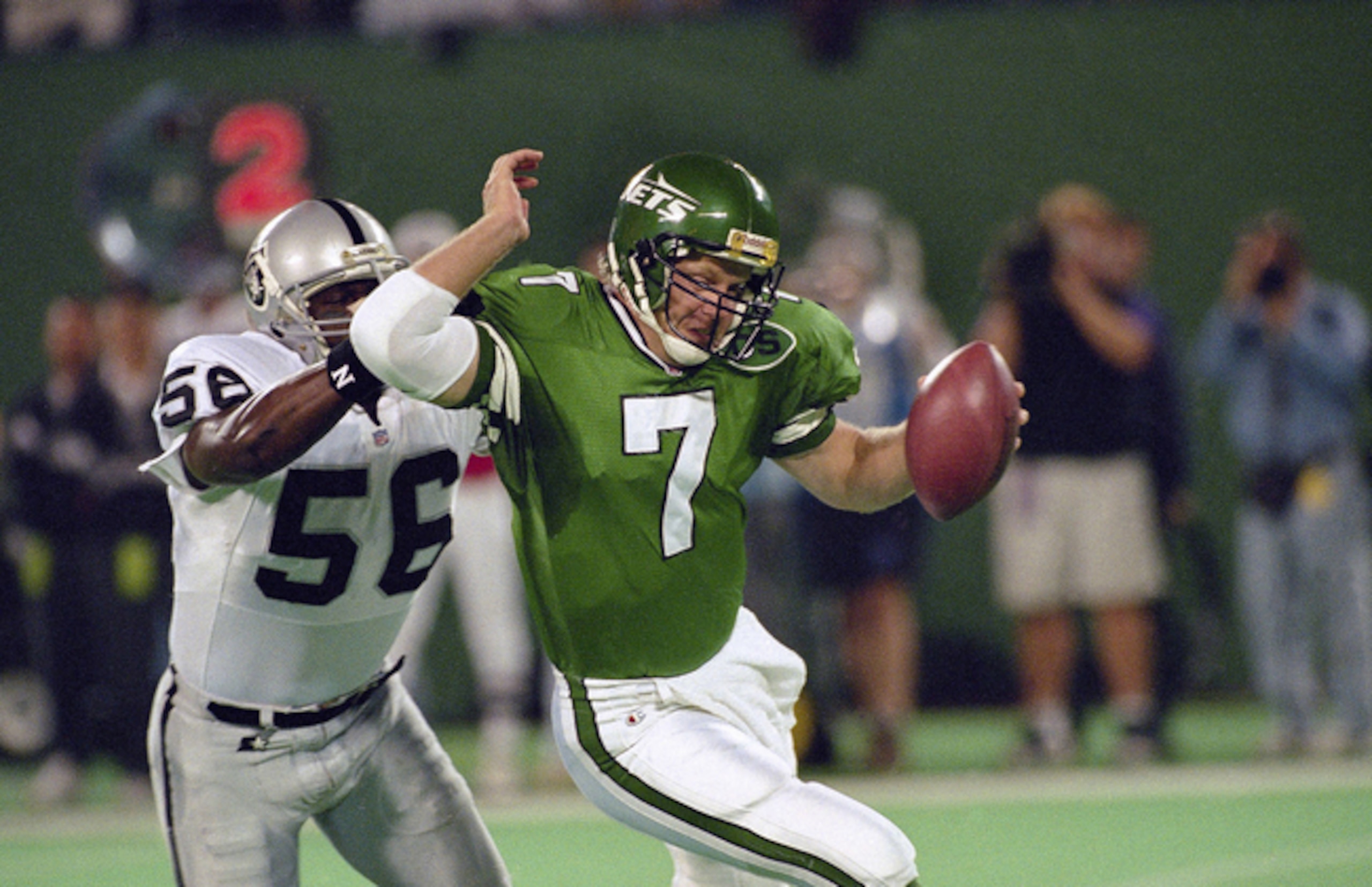 New York Jets quarterback Boomer Esiason (7) is sacked by Oakland Raiders right end Pat Swilling for a loss of 13 yards in the first quarter at Giants Stadium in East Rutherford, N.J., Oct. 1, 1995. The Raiders won 47-10. (AP Photo/Bill Kostroun)