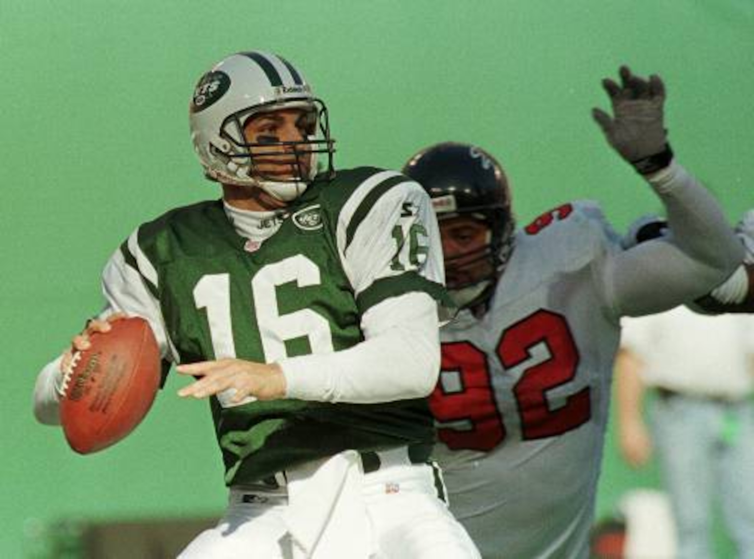 New York Jets quarterback Vinny Testaverde throws under pressure from Atlanta Falcons defensive end Lester Archambeau in the first quarter  Sunday, Oct. 25, 1998 in East Rutherford, N.J.  (AP Photo/Bill Kostroun)