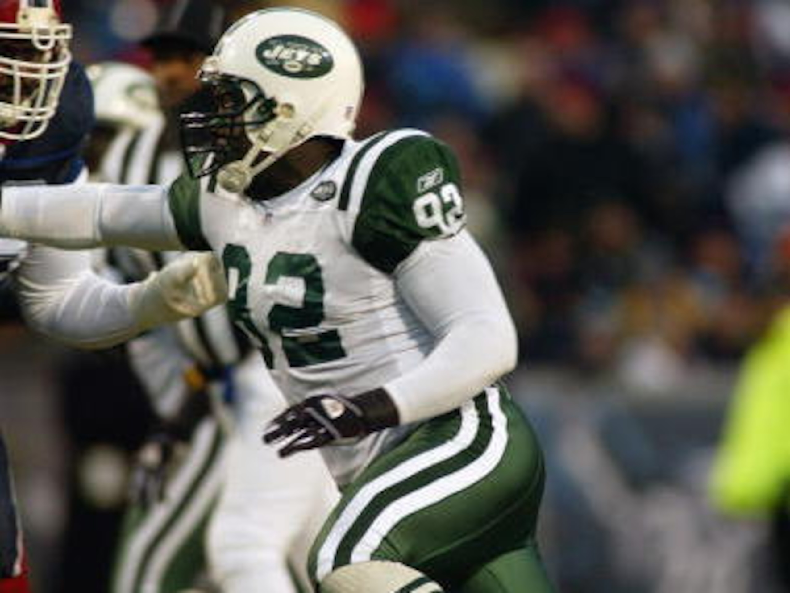 ORCHARD PARK, NY - DECEMBER 7:  Defensive end Shaun Ellis #92 of the New York Jets attempts to make a play during the game gainst the Buffalo Bills on December 7, 2003 at Ralph Wilson Stadium in Orchard Park, New York. The Bills defeated the Jets 17-6.(Ph
