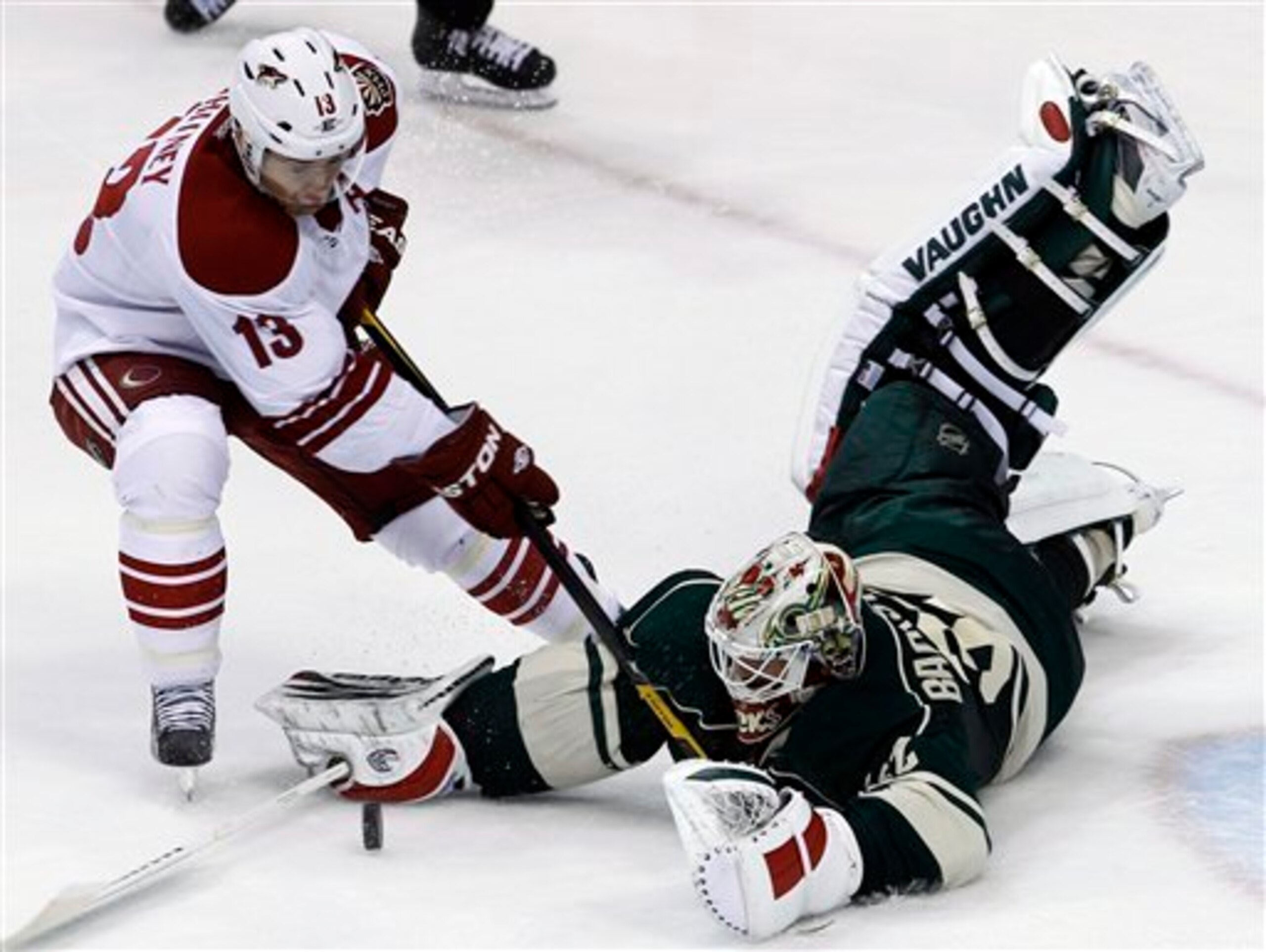 Minnesota Wild goalie Niklas Backstrom, right, of Finland, makes a diving stop on a shot by Phoenix Coyotes left wing Ray Whitney (13) during the third period of an NHL hockey game in St. Paul, Minn., Saturday, Dec. 31, 2011. The Coyotes won 4-2. (AP Phot Minnesota Wild goalie Niklas Backstrom, right, of Finland, makes a diving stop on a shot by Phoenix Coyotes left wing Ray Whitney (13) during the third period of an NHL hockey game in St. Paul, Minn., Saturday, Dec. 31, 2011. The Coyotes won 4-2. (AP Phot
