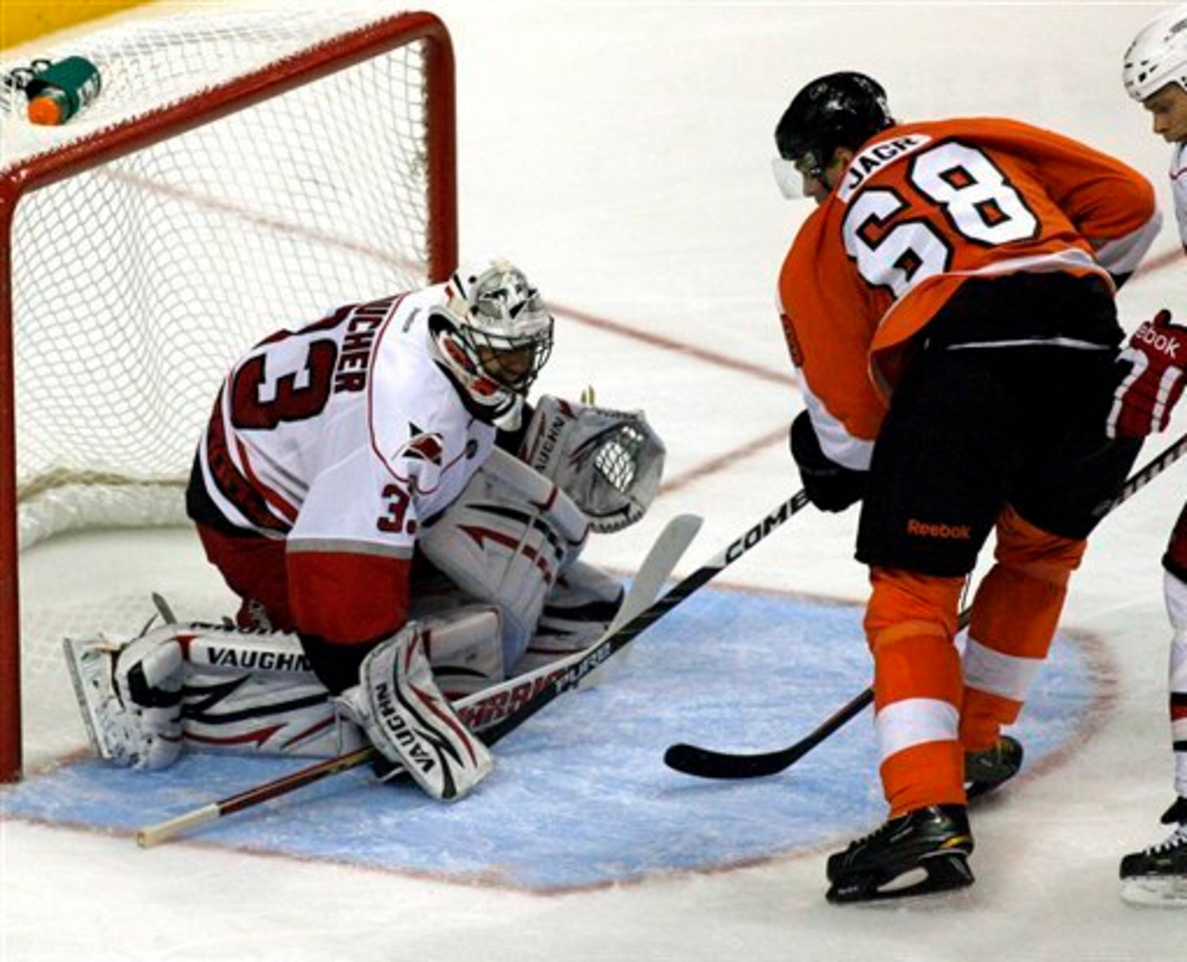 Carolina Hurricanes goalie Brian Boucher (33) stops a shot by Philadelphia Flyers' Jaromir Jagr (68) in the third period of an NHL hockey game, Saturday, Oct. 29, 2011, in Philadelphia. (AP Photo/H. Rumph, Jr.) Carolina Hurricanes goalie Brian Boucher (33) stops a shot by Philadelphia Flyers' Jaromir Jagr (68) in the third period of an NHL hockey game, Saturday, Oct. 29, 2011, in Philadelphia. (AP Photo/H. Rumph, Jr.)