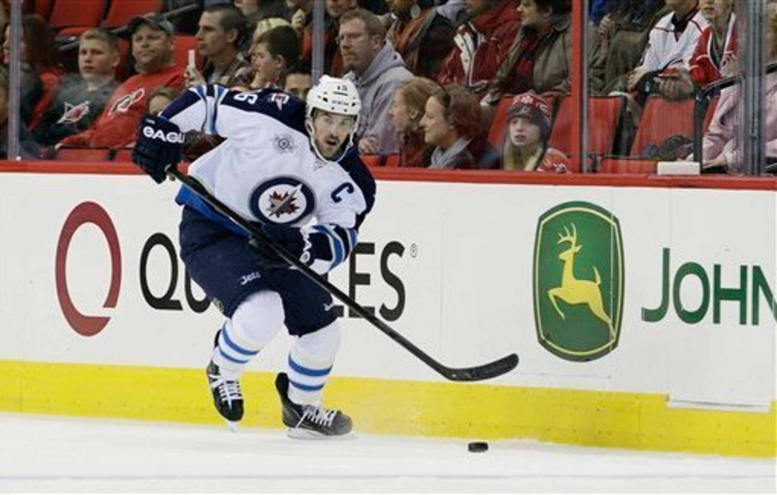 Winnipeg Jets' Andrew Ladd skates against the Carolina Hurricanes during the first period of an NHL hockey game in Raleigh, N.C., Friday, Nov. 25, 2011. (AP Photo/Gerry Broome)