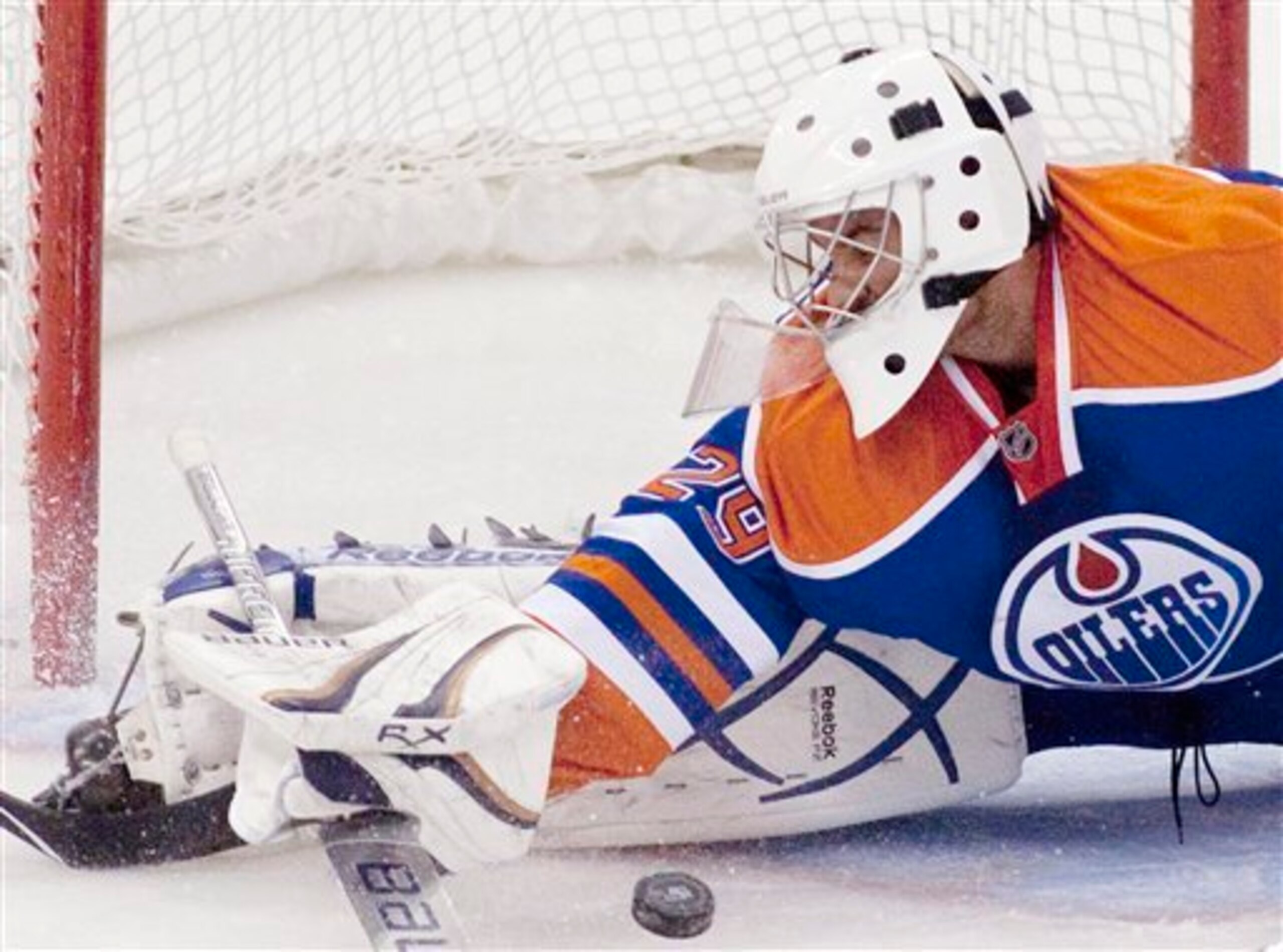 Edmonton Oiler goaltender Martin Gerber makes a save during first period NHL hockey action against the Ottawa Senators in Ottawa on Monday November 29, 2010. THE CANADIAN PRESS/Pawel Dwulit