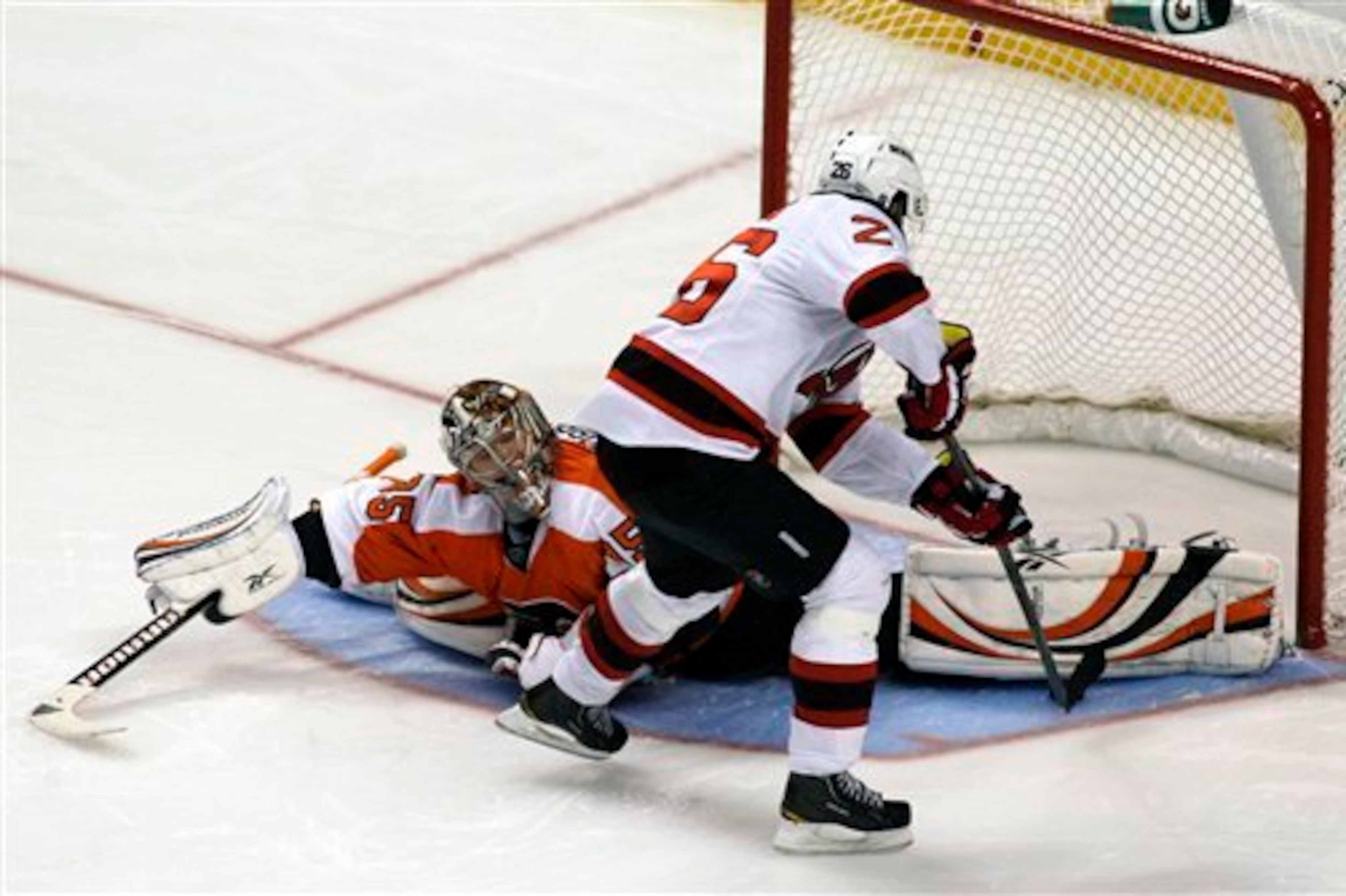 New Jersey Devils' Patrik Elias (26) scores against Philadelphia Flyers goalie Sergei Bobrovsky (35) during the shootout of an NHL hockey game Thursday, Nov. 3, 2011, in Philadelphia. The Devils won 4-3. (AP Photo/H. Rumph Jr.)