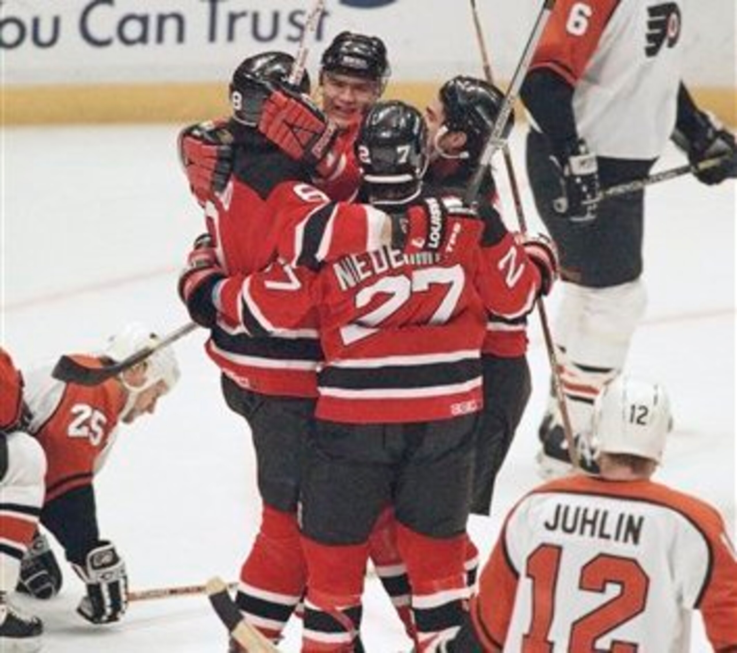 New Jersey Devils Bobby Holik (facing camera) is congratulated by teammates Mike Peluso left, Scott Niedermayer (27) and Randy McKay, right, as Philadelphia Flyers Chris Therien (6) and Patrik Juhlin (12) skate away after Holik's goal in the second period New Jersey Devils Bobby Holik (facing camera) is congratulated by teammates Mike Peluso left, Scott Niedermayer (27) and Randy McKay, right, as Philadelphia Flyers Chris Therien (6) and Patrik Juhlin (12) skate away after Holik's goal in the second period