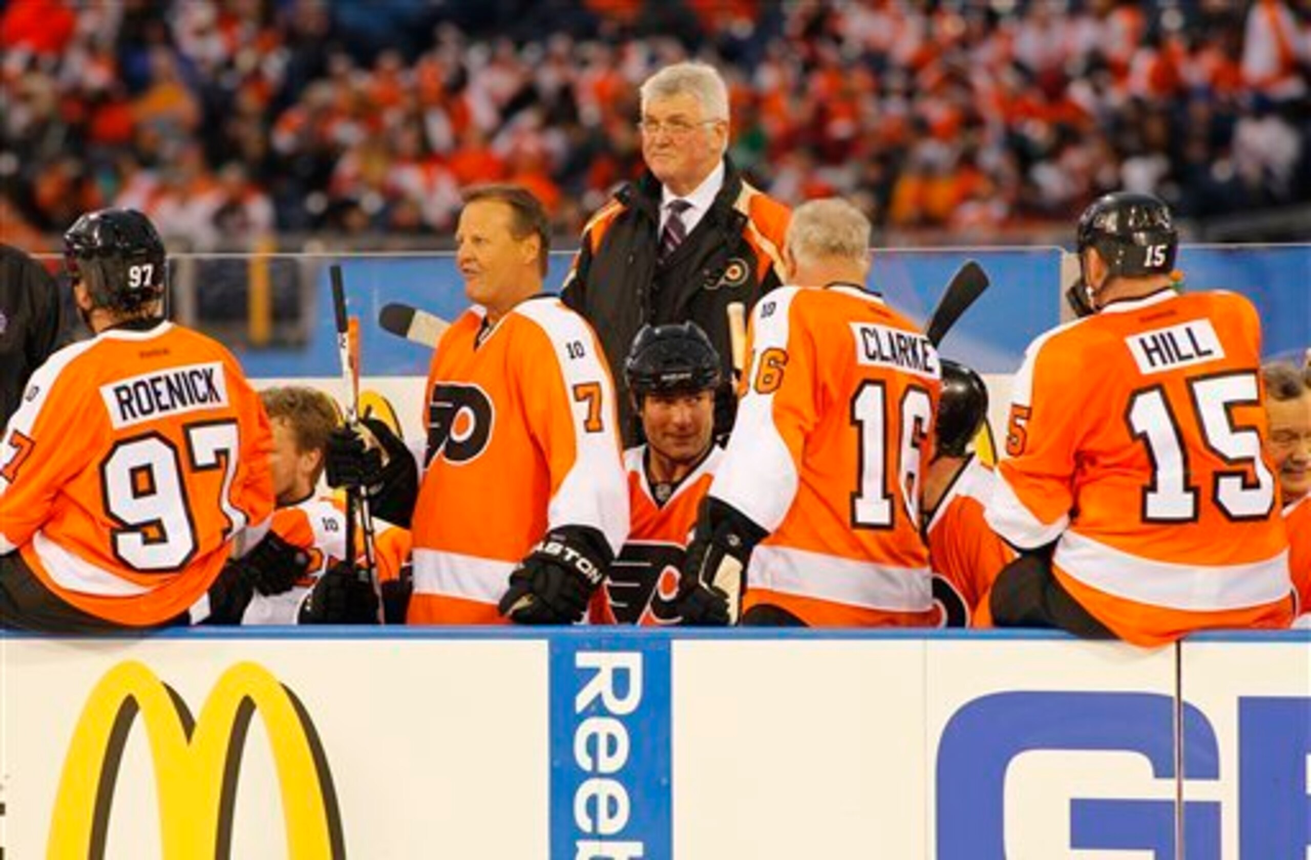 Members of the Philadelphia Flyers Alumni team, from the left, Bill Barber, Eric Lindros, Bob Clarke and coach Pat Quinn (standing) on the bench during the Winter Classic Alumni hockey game with the New York Rangers Alumni team, Saturday, Dec. 31, 2011 in Members of the Philadelphia Flyers Alumni team, from the left, Bill Barber, Eric Lindros, Bob Clarke and coach Pat Quinn (standing) on the bench during the Winter Classic Alumni hockey game with the New York Rangers Alumni team, Saturday, Dec. 31, 2011 in
