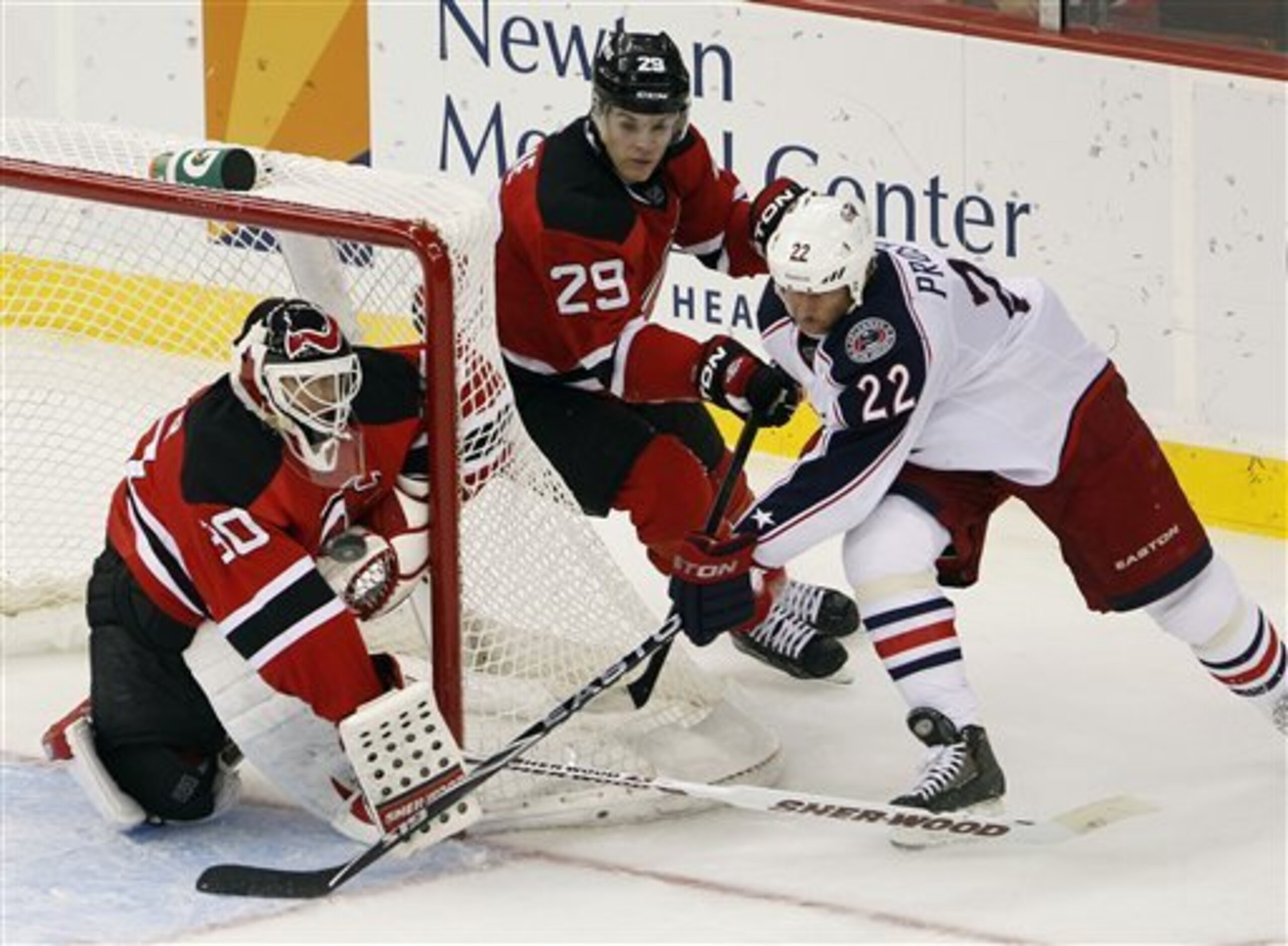New Jersey Devils goalie Martin Brodeur (30) keeps his eye on the puck as Columbus Blue Jackets' Vinny Prospal (22), of the Czech Republic, makes an attempt on the net in front of Devils' Mark Fayne (29) during the second period of an NHL hockey game, Wed New Jersey Devils goalie Martin Brodeur (30) keeps his eye on the puck as Columbus Blue Jackets' Vinny Prospal (22), of the Czech Republic, makes an attempt on the net in front of Devils' Mark Fayne (29) during the second period of an NHL hockey game, Wed