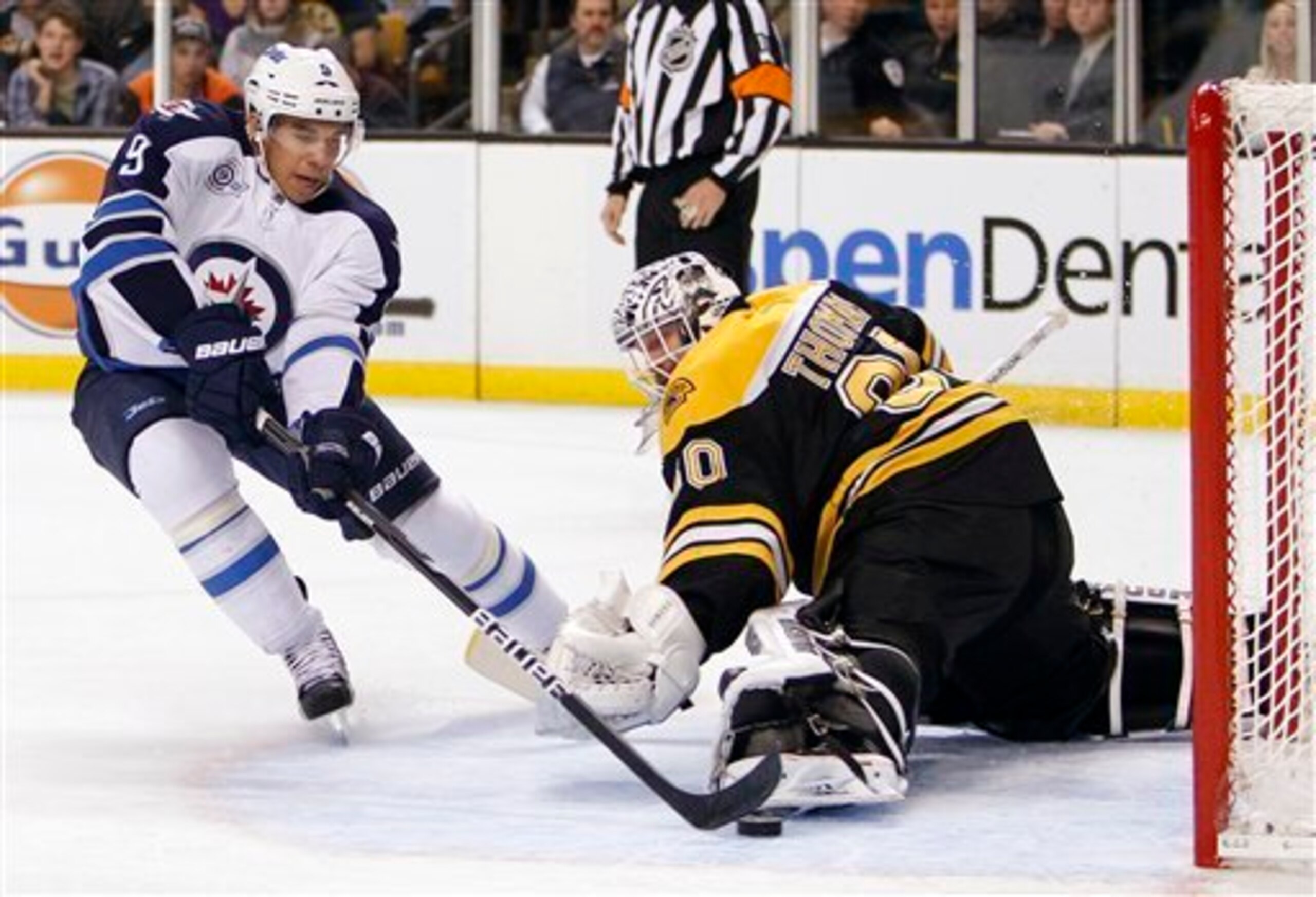 Winnipeg Jets' Evander Kane (9) scores on Boston Bruins goalie Tim Thomas in the first period of an NHL hockey game in Boston, Saturday, Nov. 26, 2011. (AP Photo/Michael Dwyer)