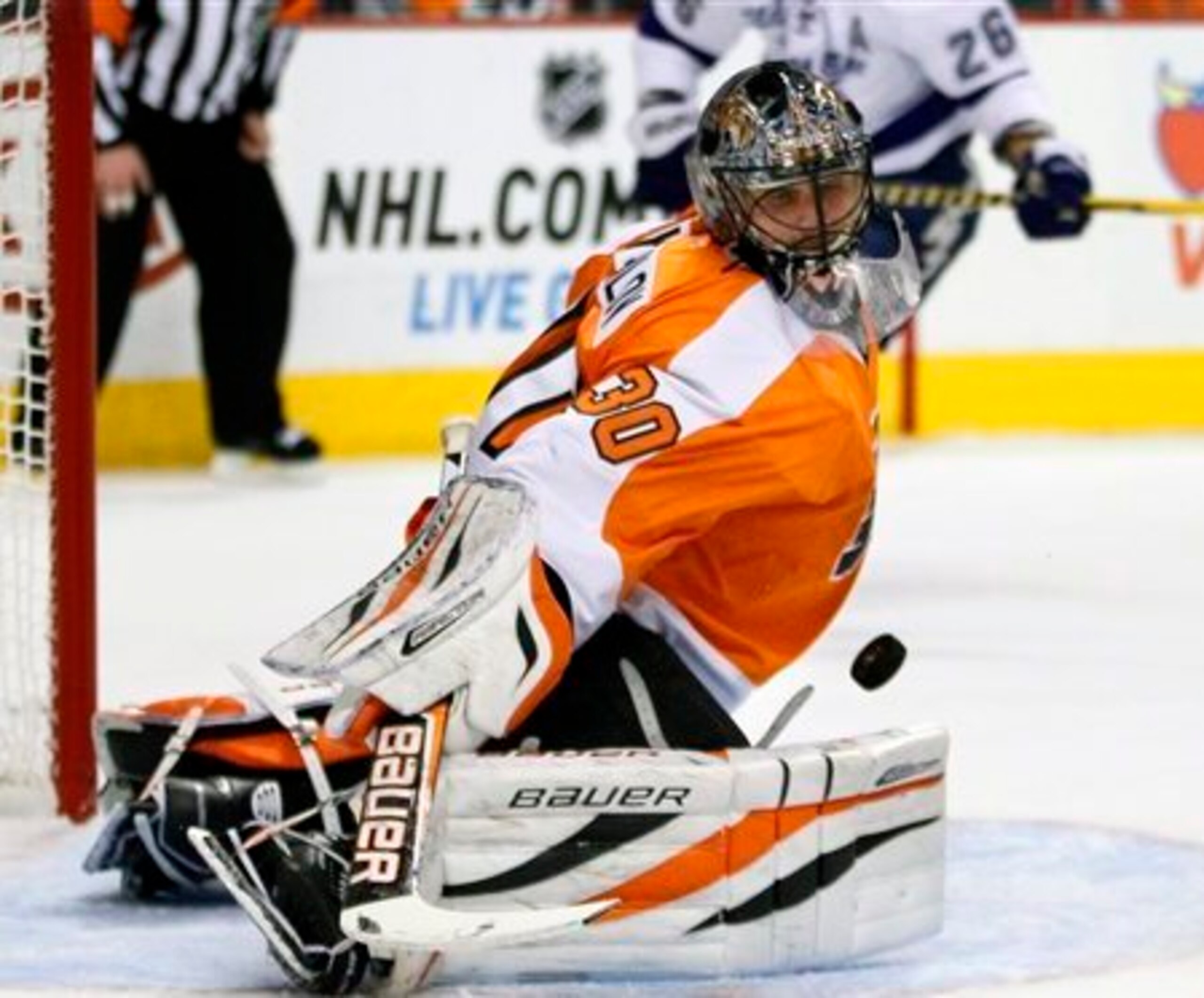 FILE - in this Feb. 5, 2013, file photo, Philadelphia Flyers' Ilya Bryzgalov deflects a shot during an NHL hockey game against the Tampa Bay Lightning in Philadelphia. Calling the decision to sign Bryzgalov two years ago a