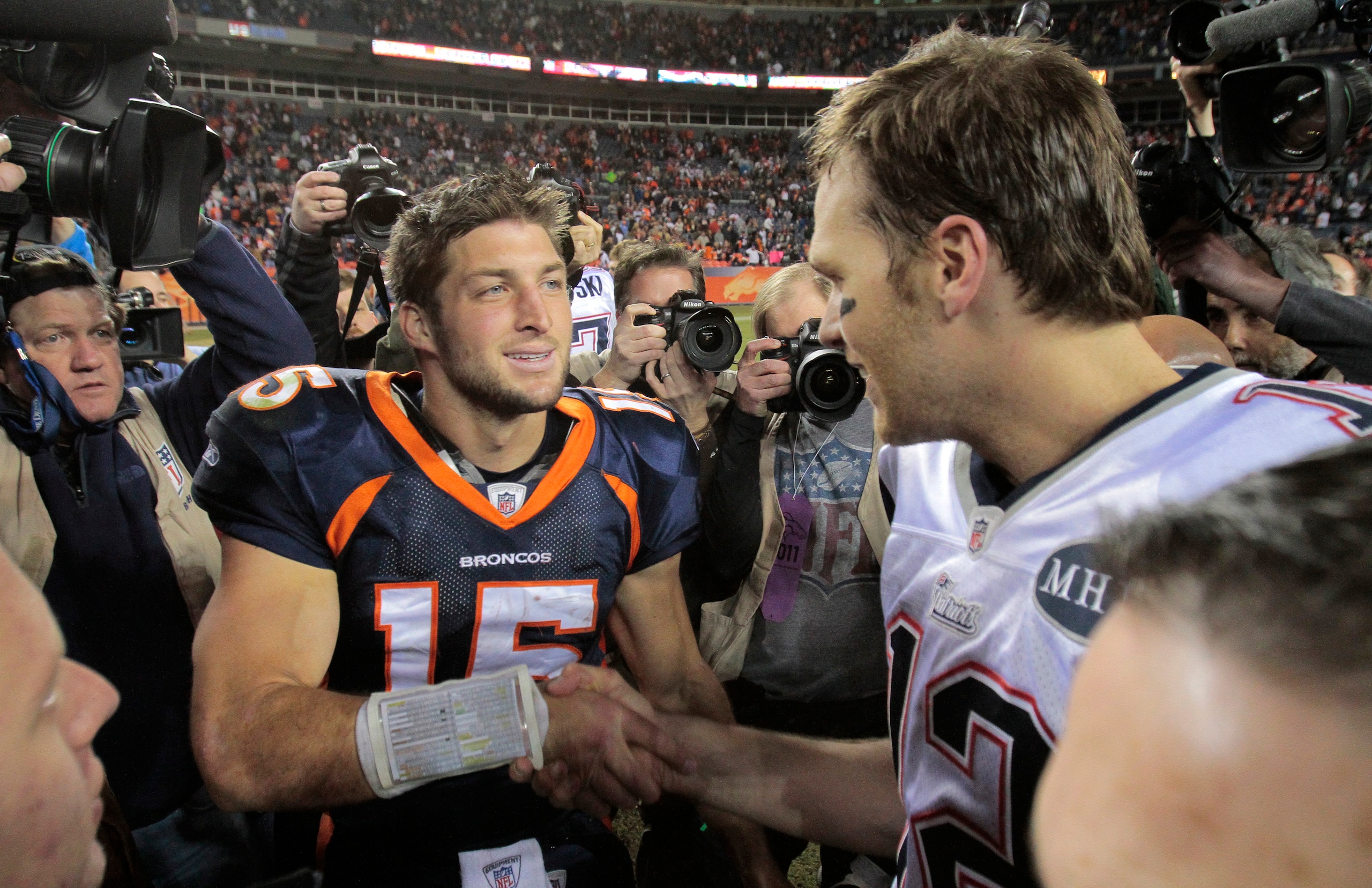 Denver Broncos quarterback Tim Tebow (15) greets New England Patriots quarterback Tom Brady (12) after an NFL football game, Sunday, Dec. 18, 2011, in Denver. (AP Photo/Barry Gutierrez) Denver Broncos quarterback Tim Tebow (15) greets New England Patriots quarterback Tom Brady (12) after an NFL football game, Sunday, Dec. 18, 2011, in Denver. (AP Photo/Barry Gutierrez)