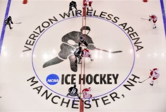The puck drops at center ice kicking off a Northeast regional semifinal game in the NCAA college hockey tournament in Manchester, N.H., Saturday, March 26, 2011.  (AP Photo/Josh Gibney)