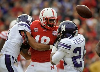 LINCOLN, NE - NOVEMBER 05: Cornerback Jeravin Matthews #3 of the Northwestern Wildcats knocks the ball loose from wide receiver Quincy Enunwa #18 of the Nebraska Cornhuskers during their game at Memorial Stadium November 5, 2011 in Lincoln, Nebraska. Nor LINCOLN, NE - NOVEMBER 05: Cornerback Jeravin Matthews #3 of the Northwestern Wildcats knocks the ball loose from wide receiver Quincy Enunwa #18 of the Nebraska Cornhuskers during their game at Memorial Stadium November 5, 2011 in Lincoln, Nebraska. Nor