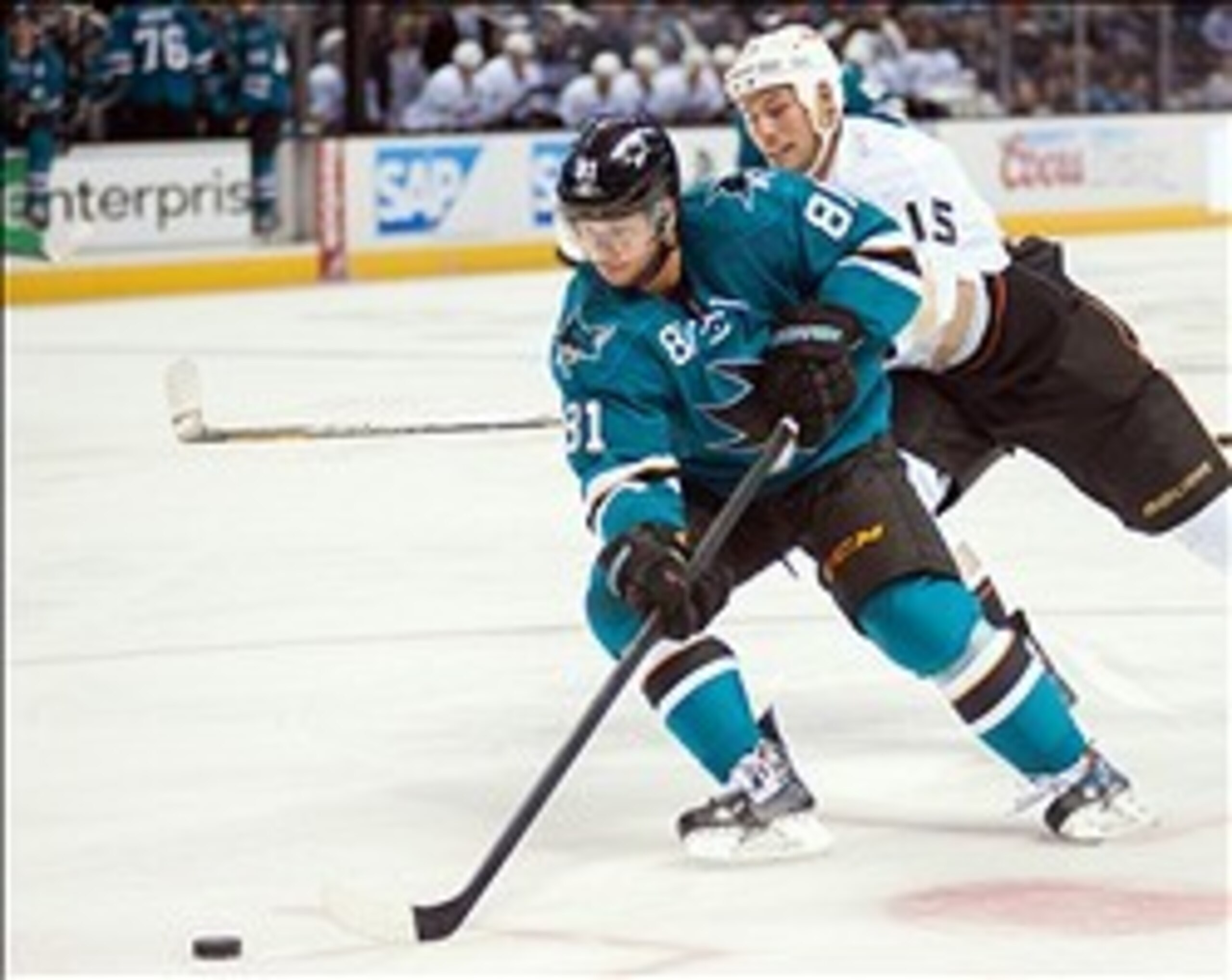Sep 20, 2013; San Jose, CA, USA; San Jose Sharks center Tyler Kennedy (81) controls the puck against Anaheim Ducks center Ryan Getzlaf (15) during the second period at the SAP Center at San Jose. Mandatory Credit: Ed Szczepanski-USA TODAY Sports