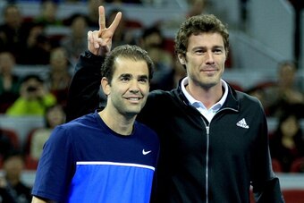 Marat Safin jokes around with Pete Sampras at 2011 exhibition.