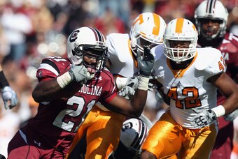 Gamecock tailback Marcus Lattimore (No. 21) was lost for the season with a knee injury suffered in last year's game with Tennessee, but South Carolina held on to win 38-35.