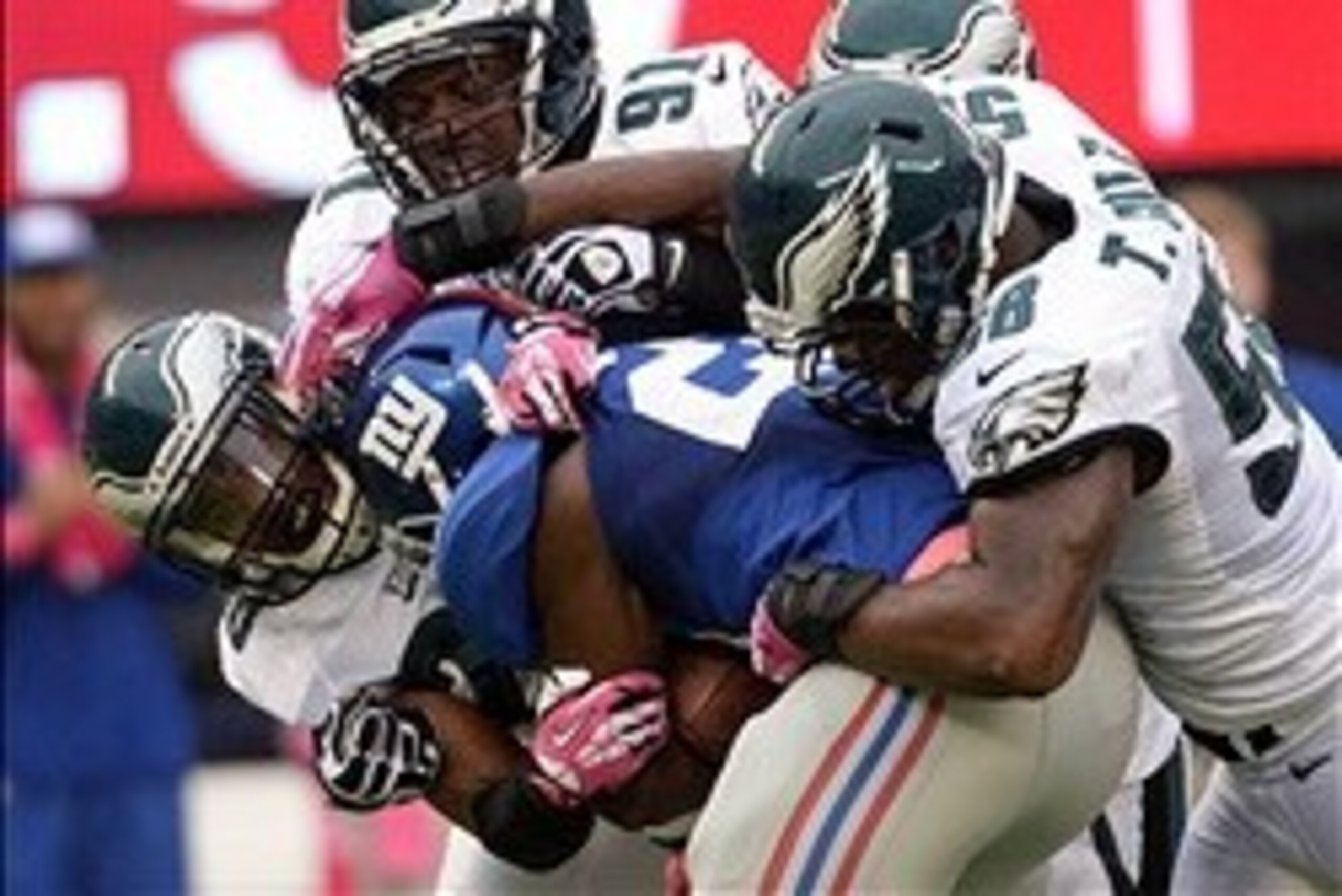 RB David Wilson is smothered by rival Eagles.