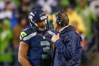 Behind Russell Wilson, Carroll got his first NFL win against Harbaugh in resounding fashion.