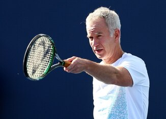 John McEnroe and his famous left hand, still in action.