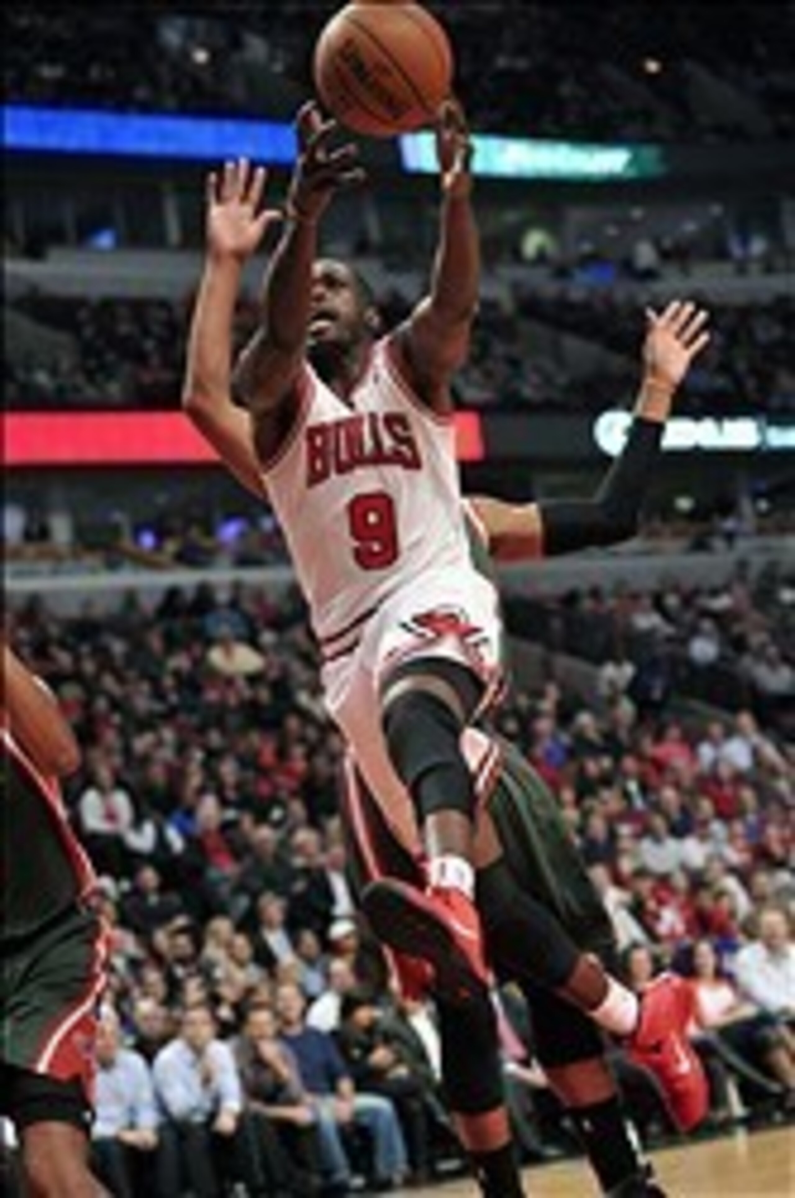 Oct 21, 2013; Chicago, IL, USA; Chicago Bulls small forward Luol Deng (9) drives to the basket against the Milwaukee Bucks during the first half at the United Center. Mandatory Credit: Rob Grabowski-USA TODAY Sports