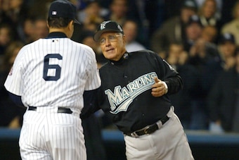McKeon shakes hands with Yankees manager Joe Torre at the start of Game 1 of the 2003 World Series.
