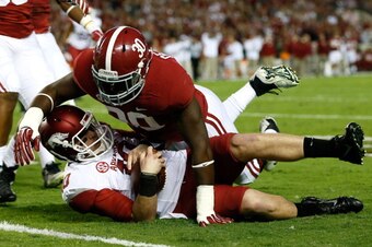 QB Brandon Allen is sacked against Alabama.