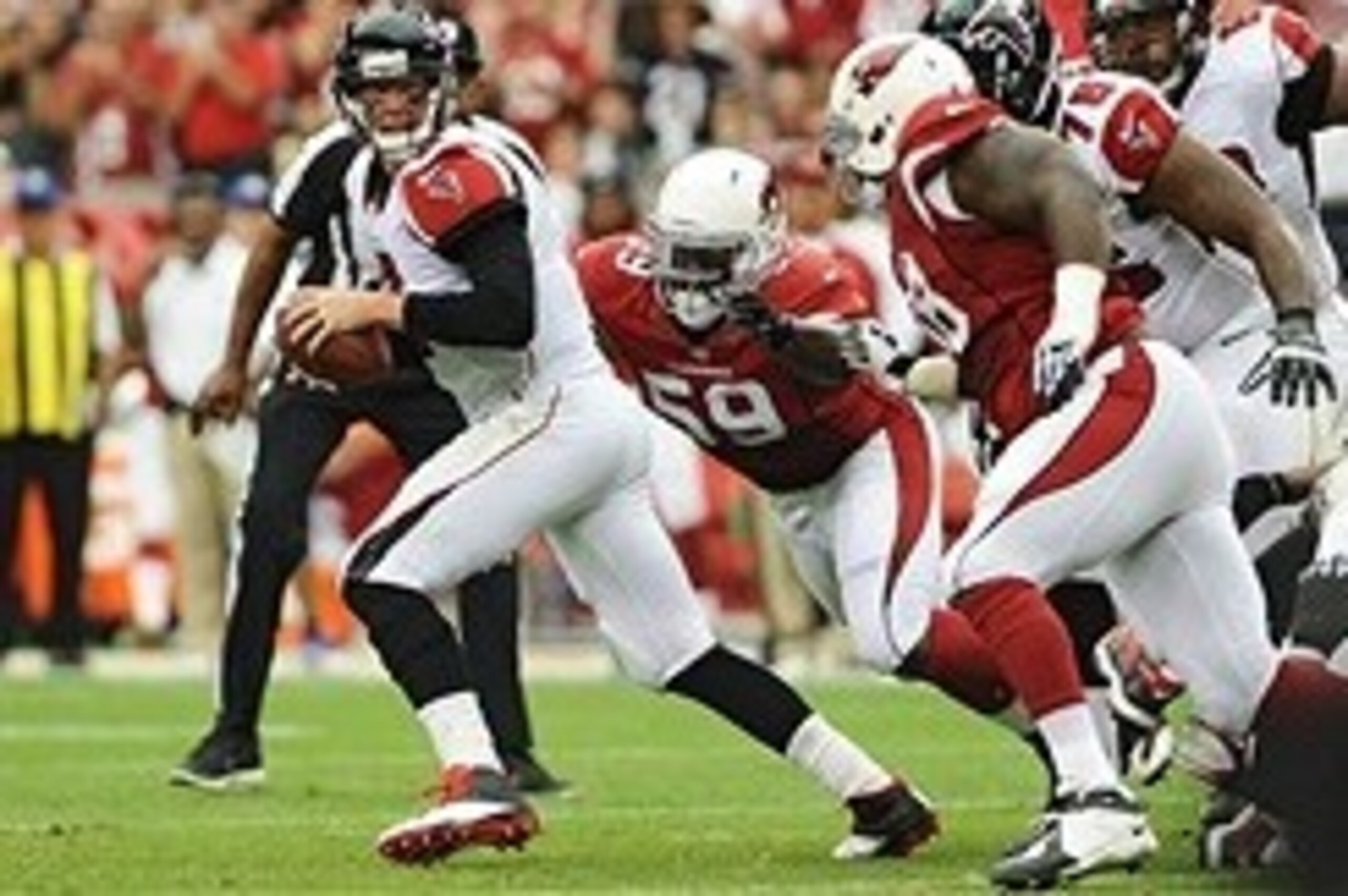 Oct 27, 2013; Phoenix, AZ, USA; Atlanta Falcons quarterback Matt Ryan (2) is sacked by Arizona Cardinals linebacker Marcus Benard (59) in the first half at University of Phoenix Stadium. Mandatory Credit: Jennifer Stewart-USA TODAY Sports
