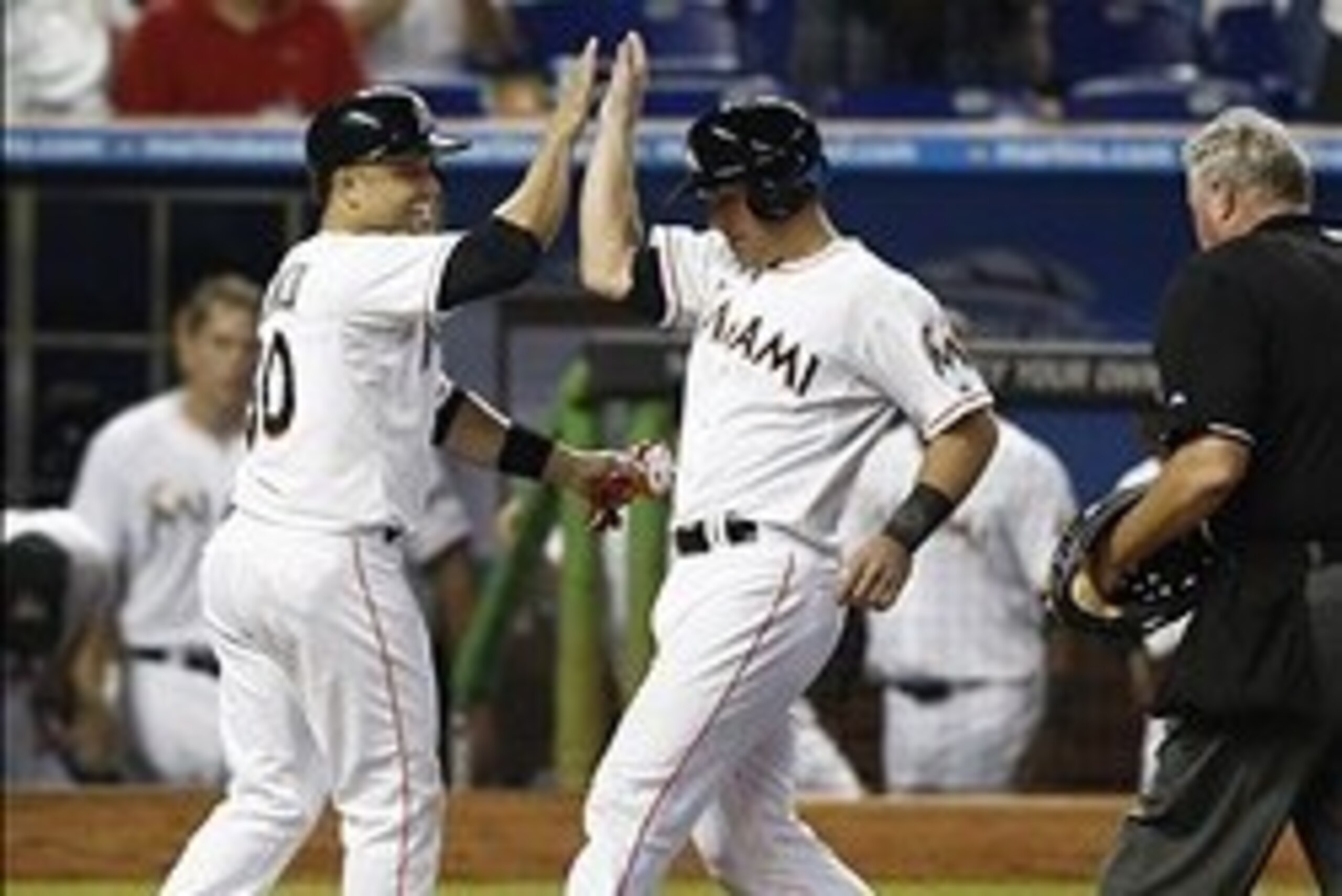 Placido Polanco, left, and Jeff Mathis played third base and catcher, respectively, for the Marlins in 2013. The Marlins could replace them as they seek to improve their abysmal offense.