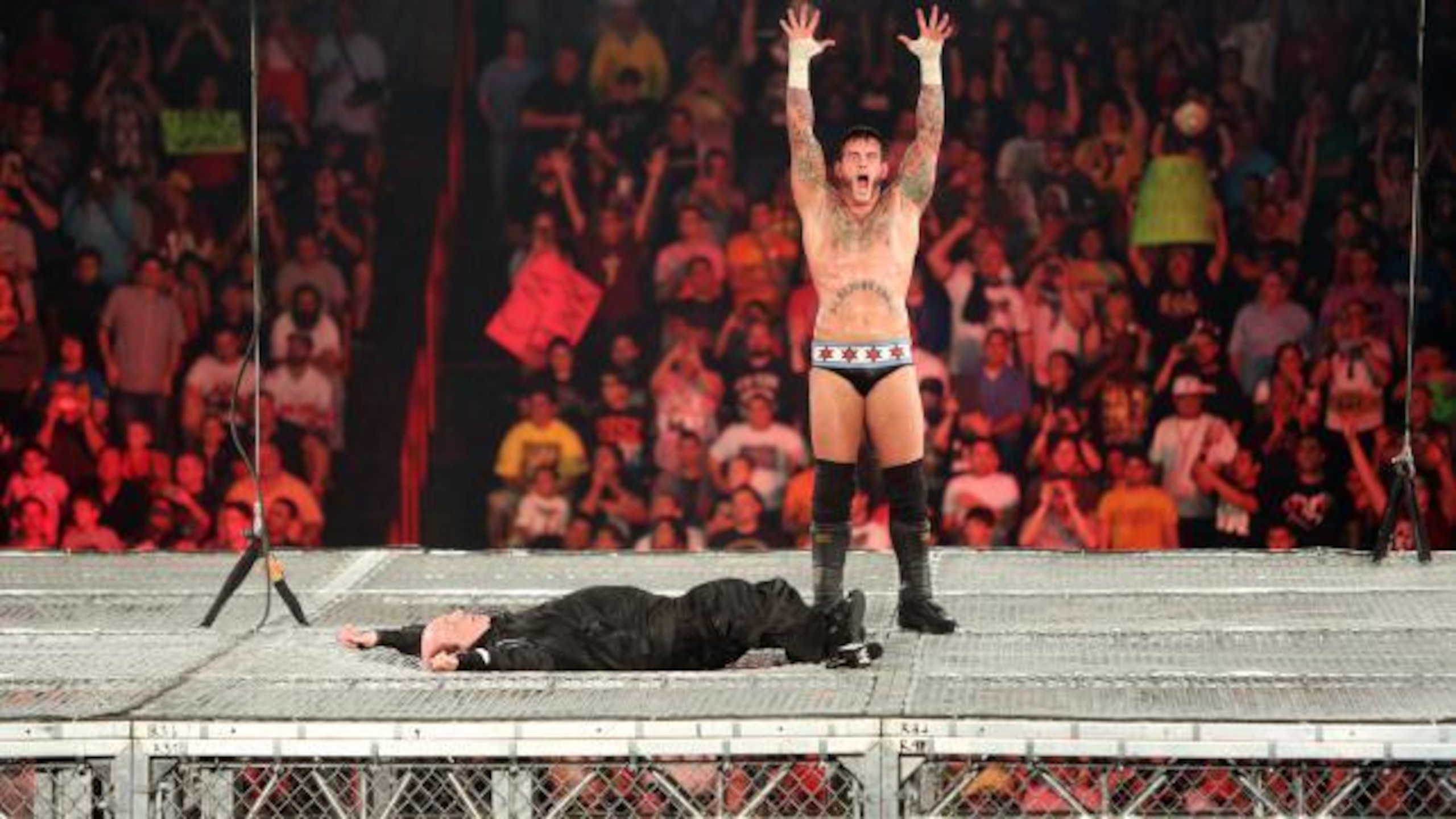 CM Punk puts Paul Heyman to sleep. CM Punk puts Paul Heyman to sleep.