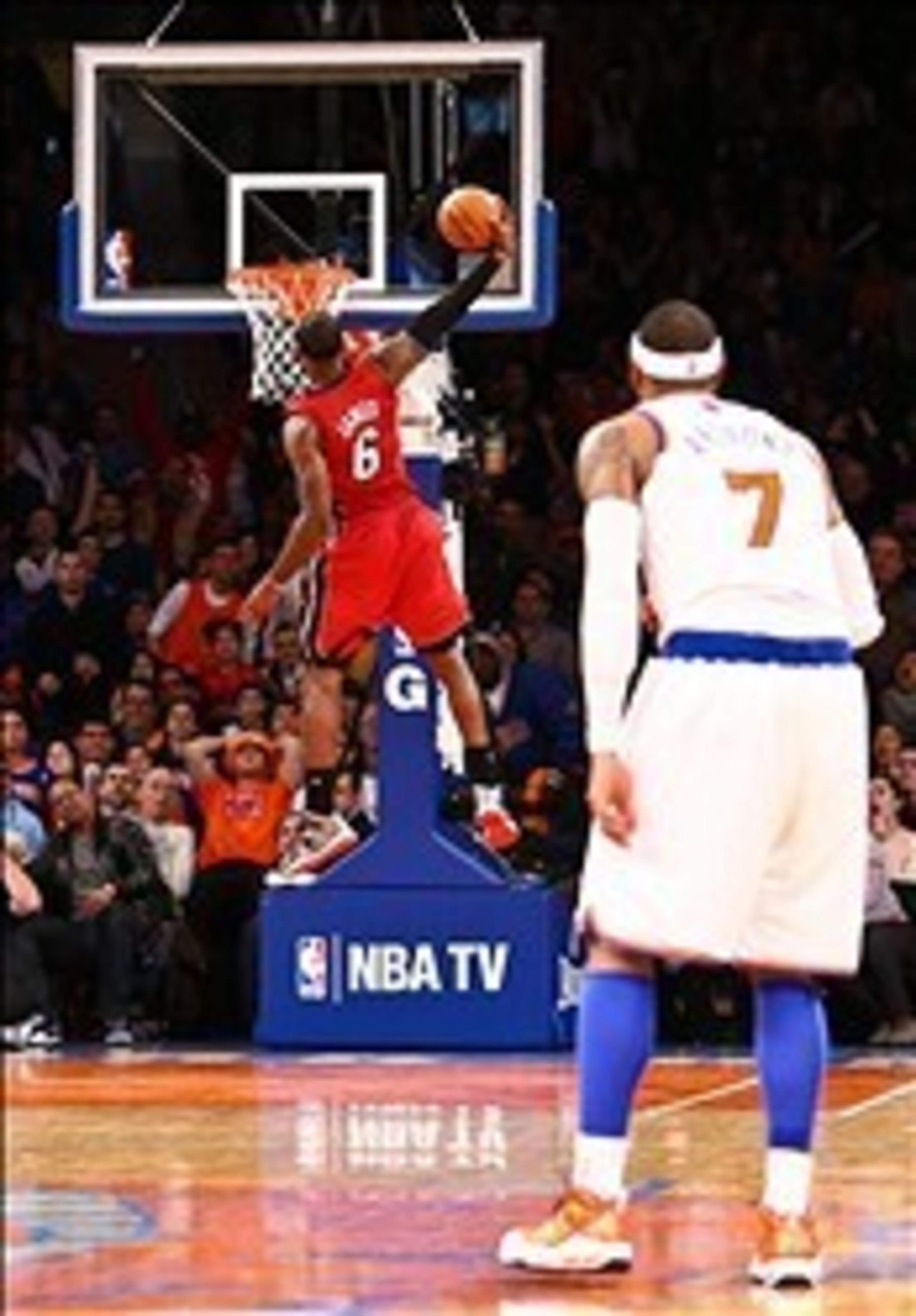 LeBron James with a huge dunk to seal the Heat victory as Carmelo Anthony watches LeBron James with a huge dunk to seal the Heat victory as Carmelo Anthony watches