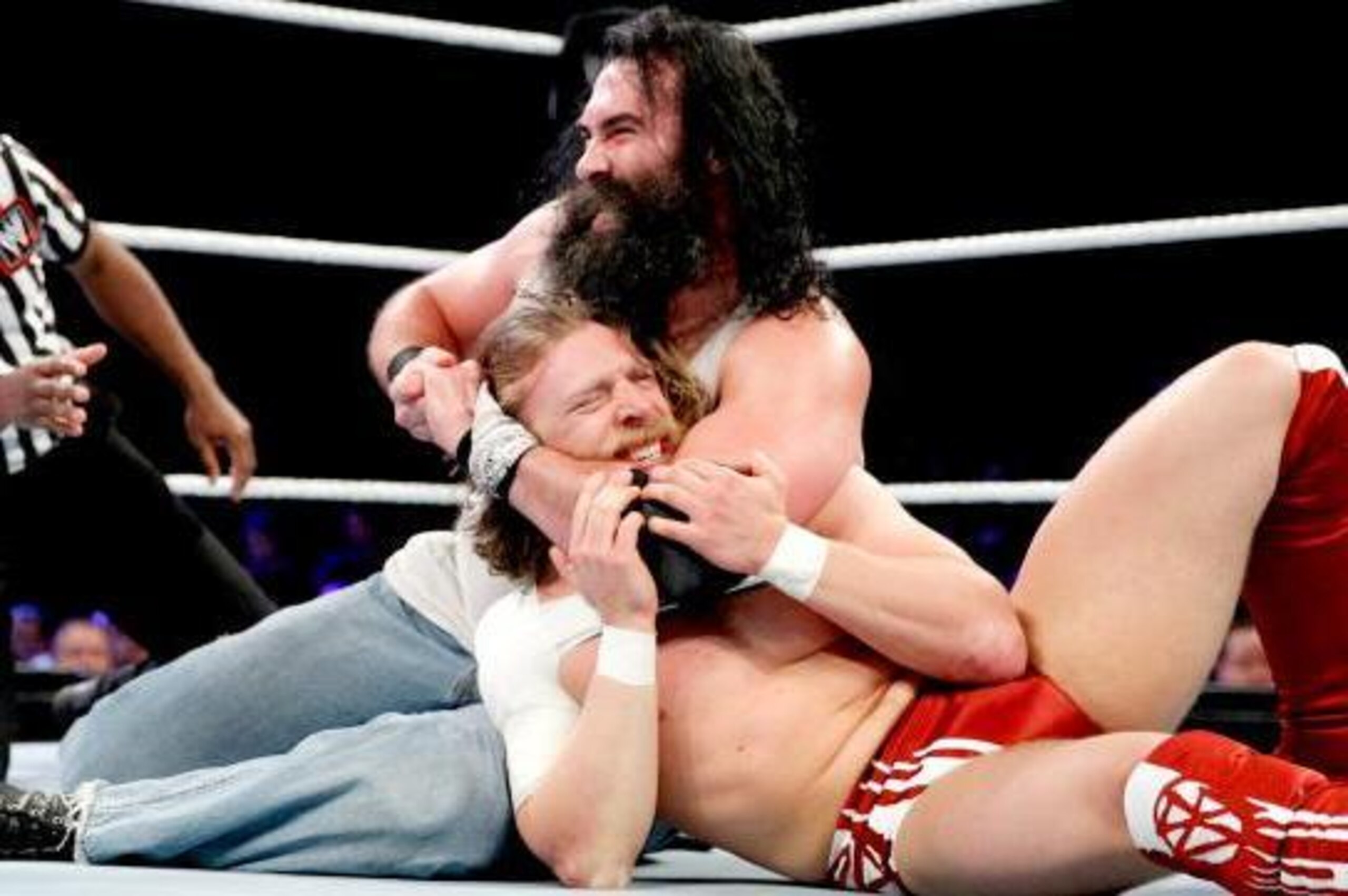 Luke Harper takes control of Daniel Bryan.