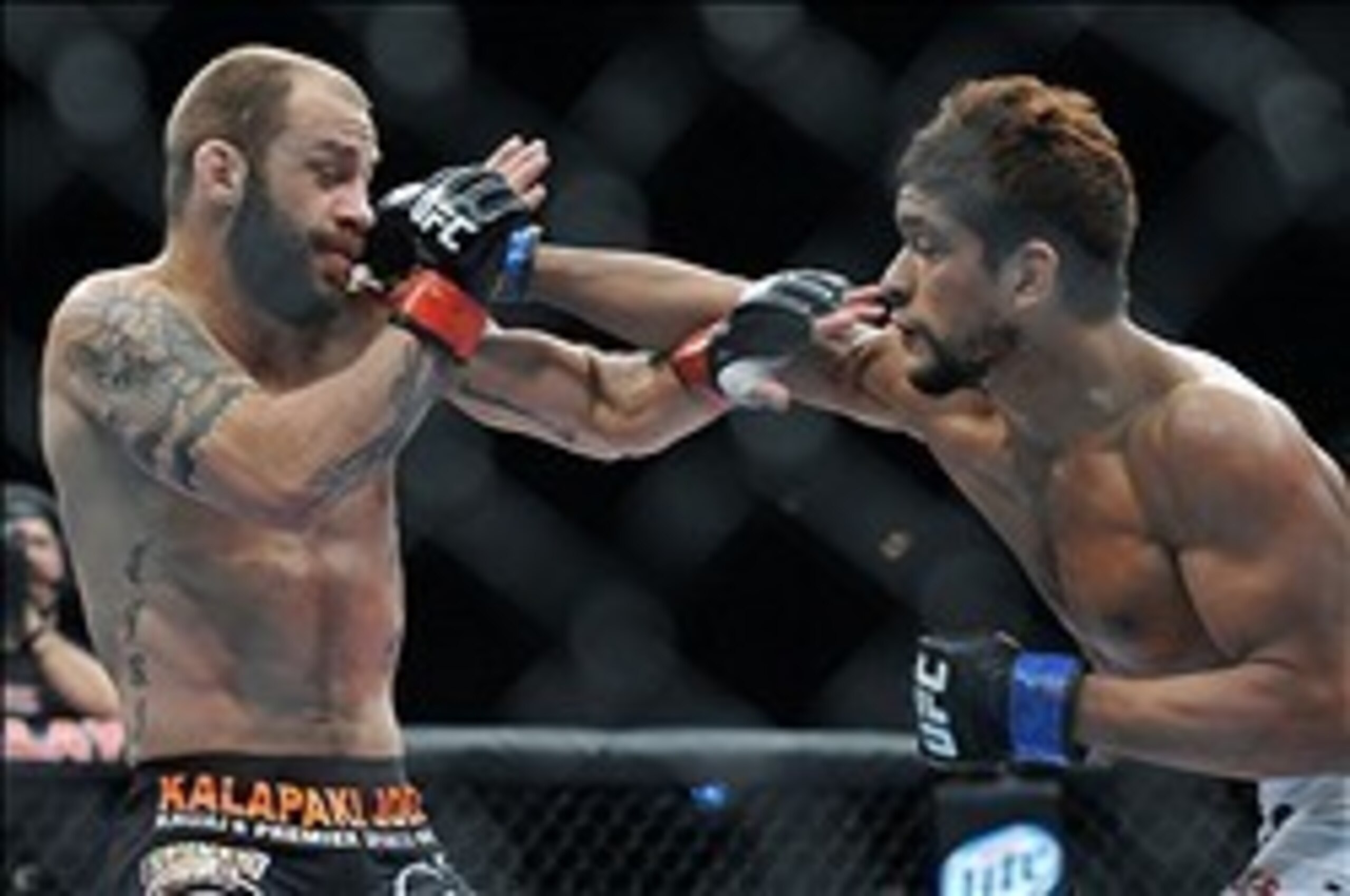 Sam Sicilia (left), shown in an earlier fight, took himself off the hot seat at Fight Night 32.